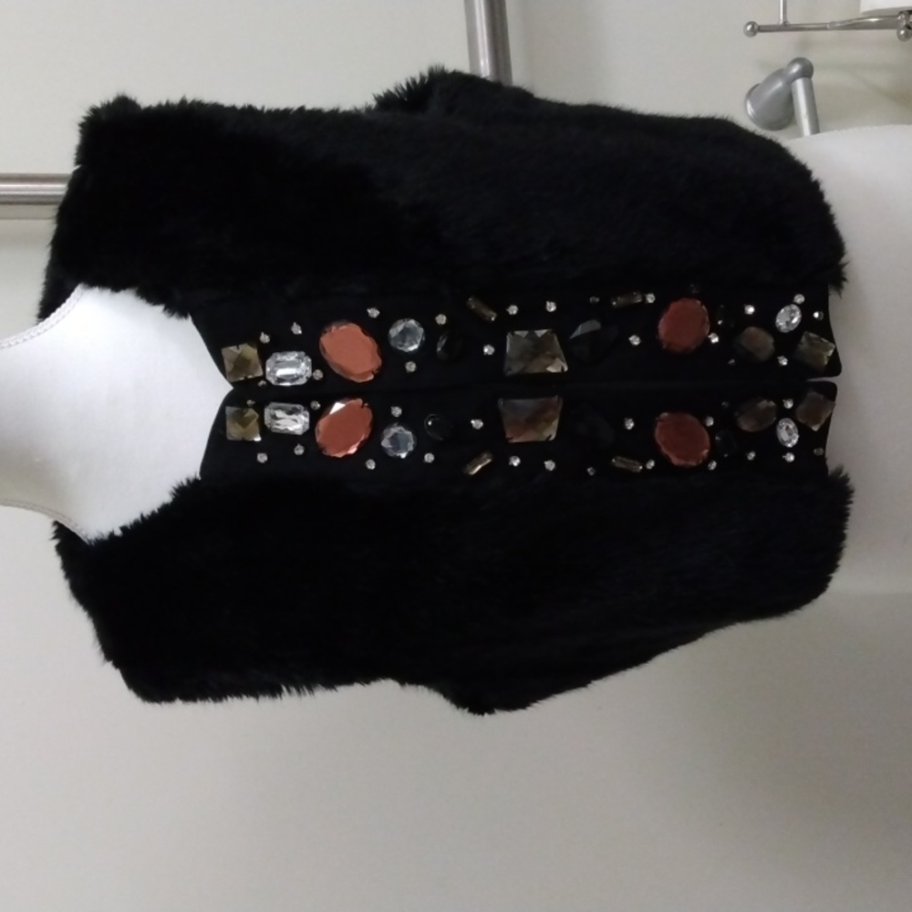 Charlotte Russe Large faux fur vest with large embellishments, 3 hook closure
